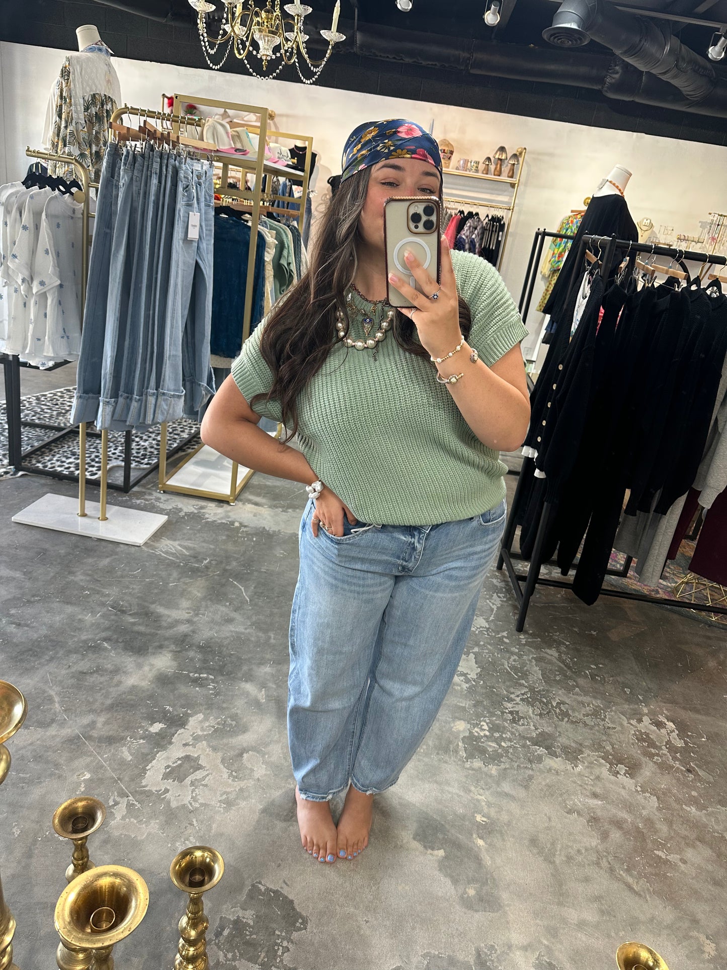 Woman in green top and jeans